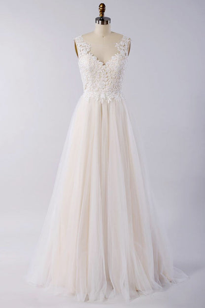 Impresionante vestido de novia de corte A con apliques de tul