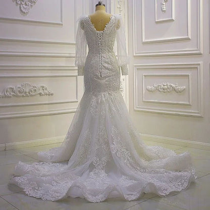 Wunderschönes Meerjungfrau-Brautkleid mit langen Ärmeln und Spitzenapplikationen und Schleppe