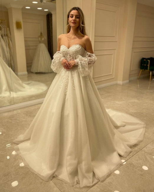 Hermosos vestidos de novia de corte A con hombros descubiertos y encaje