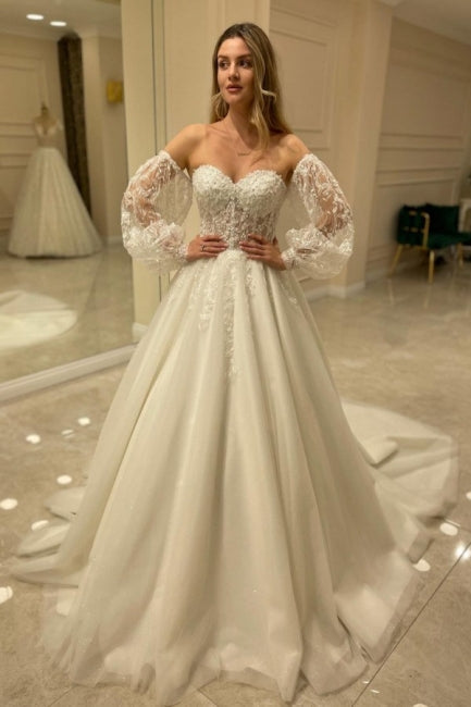 Hermosos vestidos de novia de corte A con hombros descubiertos y encaje