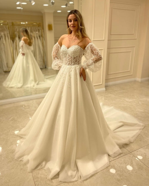 Hermosos vestidos de novia de corte A con hombros descubiertos y encaje