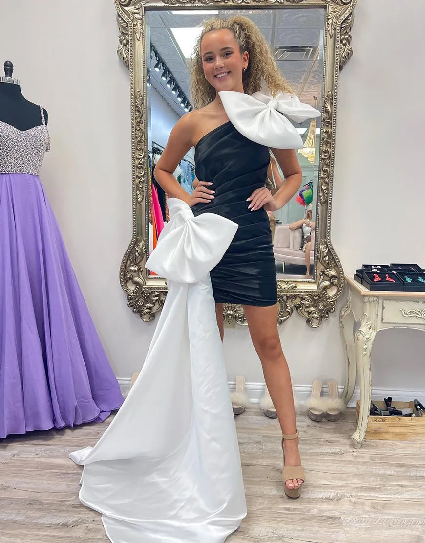 Vestido de fiesta negro ajustado de un solo hombro con lazos blancos