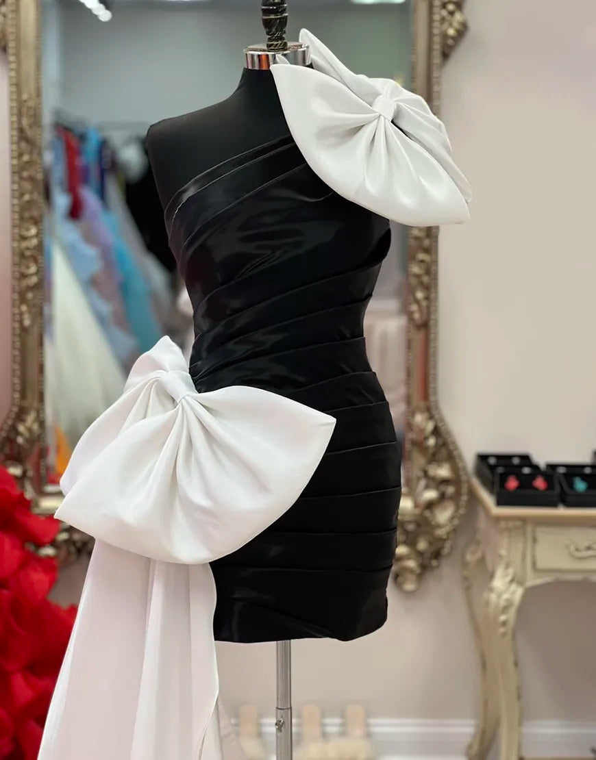 Vestido de fiesta negro ajustado de un solo hombro con lazos blancos