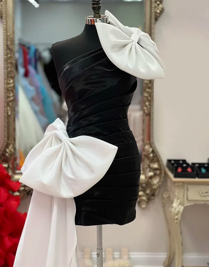 Vestido de fiesta negro ajustado de un solo hombro con lazos blancos