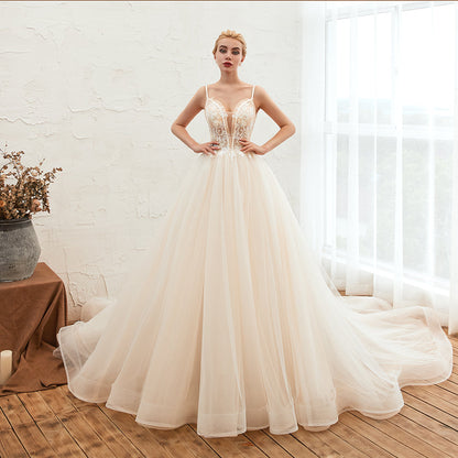 Vestido de novia bohemio de tul con tirantes finos color marfil