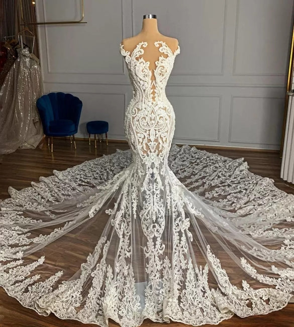 Vestido de novia de tul con apliques y corte sirena, sin mangas y con diseño de jardín de joyas
