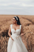 Bezauberndes langes weißes ärmelloses A-Linien-Brautkleid aus Tüll mit Spitze