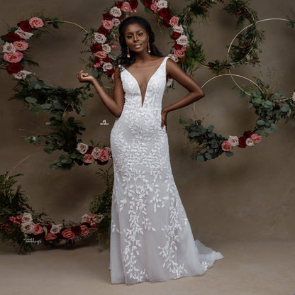 Vestido de novia de sirena con encaje sin mangas y retrato encantador