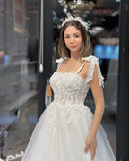 Schickes bodenlanges, ärmelloses A-Linien-Brautkleid aus Tüll mit Herzausschnitt und Applikationen