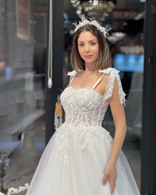 Vestido de novia elegante de tul con escote en forma de A, sin mangas, largo hasta el suelo y apliques
