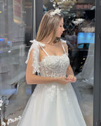Schickes bodenlanges, ärmelloses A-Linien-Brautkleid aus Tüll mit Herzausschnitt und Applikationen