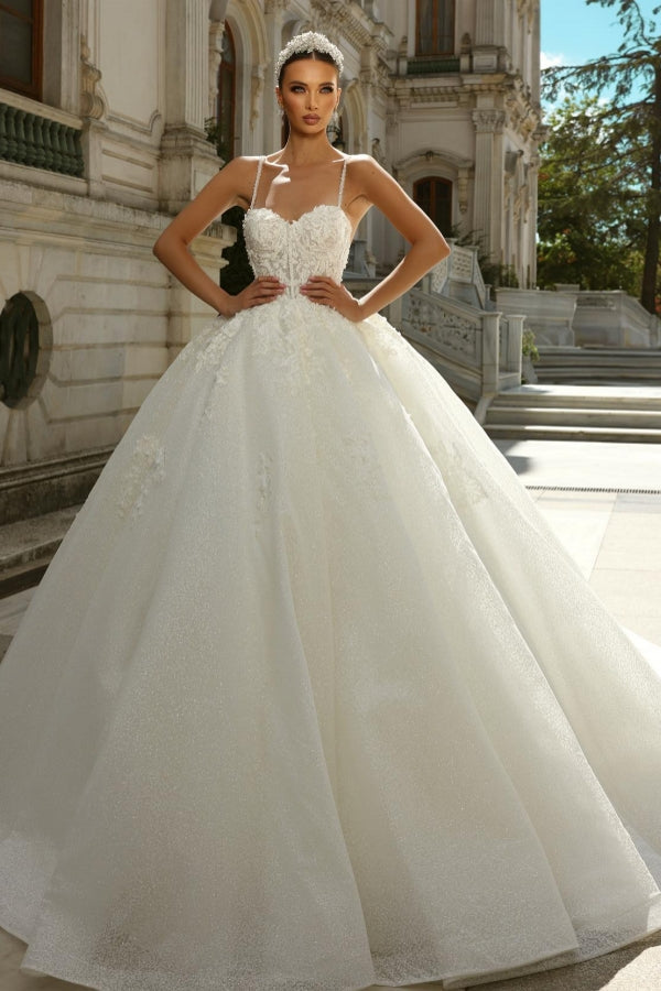 Vestido de novia elegante de corte princesa largo en A con tirantes finos en tul y encaje con purpurina en color marfil