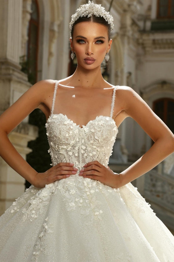 Vestido de novia elegante de corte princesa largo en A con tirantes finos en tul y encaje con purpurina en color marfil