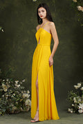 Vestido de dama de honor elegante con tirantes finos, corte halter, largo hasta el suelo, abertura y bolsillos