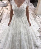 Vestido de novia elegante, largo, corte A, escote en V, apliques de encaje y cristales