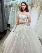 Vestido de novia elegante de tul con encaje, apliques de princesa y mangas largas