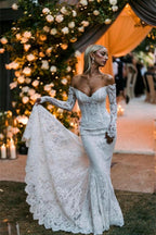 Vestidos de novia de diseñador con hombros descubiertos, mangas largas y corte sirena con encaje