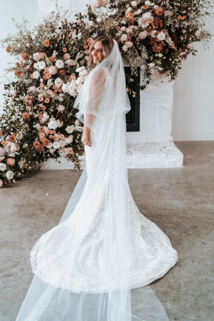 Vestidos de novia de sirena sin mangas con escote en V y encaje de diseñador