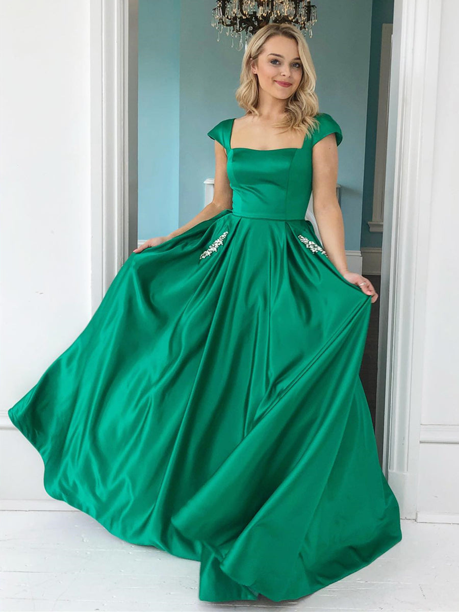 Elegante vestido de graduación largo de satén con mangas casquillo y corte A con bolsillos