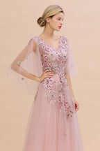 Elegante vestido de novia de tul con corte en A y flores, con mangas largas abullonadas y vestido de fiesta de noche.