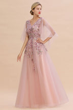 Elegante vestido de novia de tul con corte en A y flores, con mangas largas abullonadas y vestido de fiesta de noche.