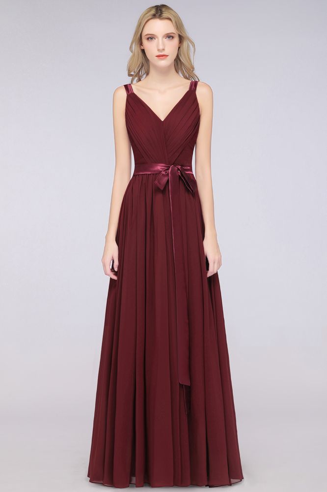 Elegante vestido de dama de honor de gasa con escote en V, tirantes, espalda descubierta y volantes hasta el suelo