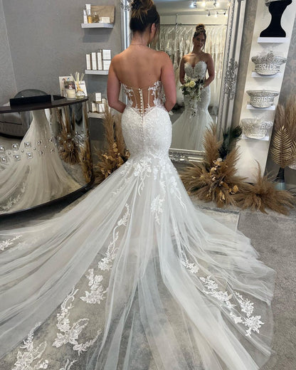Fabelhaftes bodenlanges, ärmelloses Meerjungfrau-Brautkleid mit Herzausschnitt und Spitze