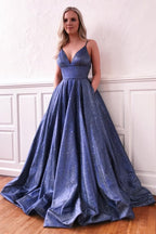 Fascinante vestido de fiesta largo de seda brillante con escote en V y corte A con bolsillos