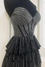 Deb | Vestido de fiesta corto con corsé, corte A, sin tirantes y con purpurina negra y cuentas