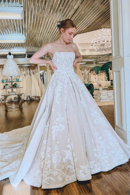 Hermosos vestidos de novia sin mangas con apliques de encaje en forma de A