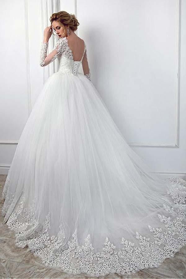 Hermoso vestido de novia largo de tul con encaje y mangas