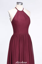 Vestido de dama de honor largo hasta el suelo, sin mangas y con cuello halter y volantes