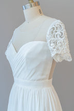 Vestido de novia largo de gasa con corte en A, espalda descubierta y mangas