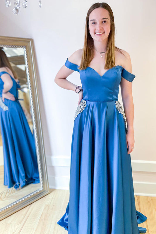 Langes schulterfreies A-Linien-Ballkleid mit Taschen und Kristallverzierung