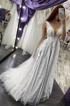 Vestido de novia largo con escote en V, tirantes finos, apliques de perlas y espalda descubierta