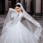 Vestido de novia largo de princesa con tul, cuentas, apliques de encaje y mangas