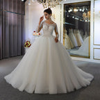 Vestido de novia de manga larga, corte en A, con escote barco, apliques de encaje y lentejuelas