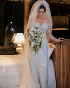 Langärmliges Meerjungfrau-Brautkleid mit schulterfreiem Tüll und Spitzenapplikationen
