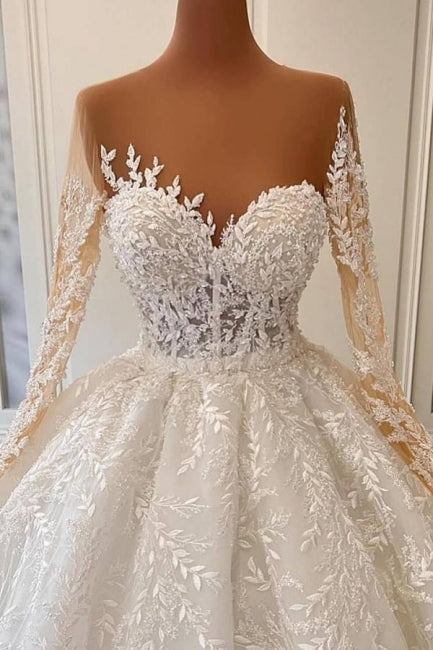 Lujosos vestidos de novia estilo princesa con encaje, manga larga y corte A