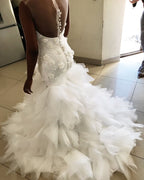 Meerjungfrau Blumenapplikationen Rüschenloses Brautkleid Transparenter Tüll Rückenfrei Ärmellos Brautmode
