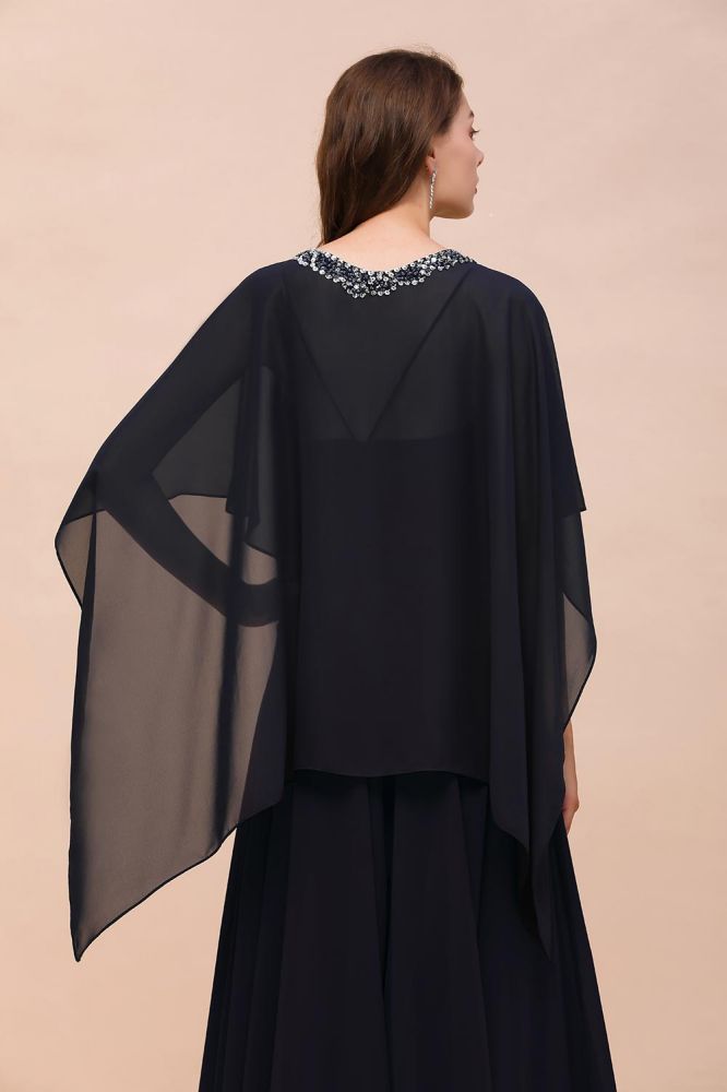 Vestido de dama de honor azul marino con pedrería envolvente, largo hasta el suelo, de gasa.