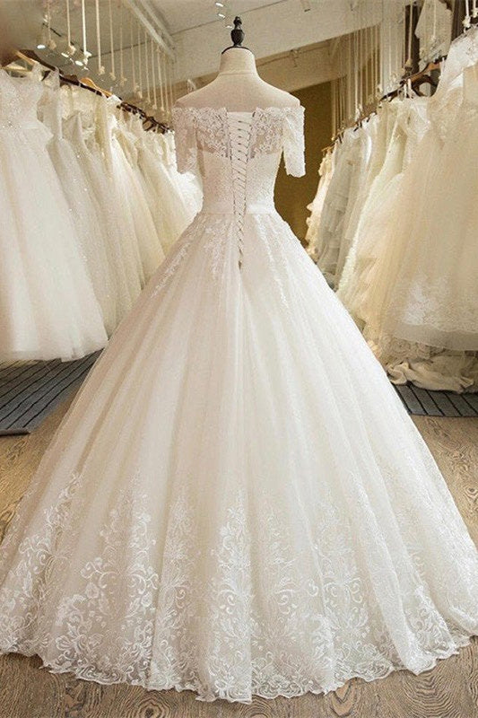 Vestido de novia de tul con encaje y hombros descubiertos, mangas 1/2