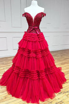 Vestido de fiesta largo rosa de tul con volantes y hombros descubiertos con lazo