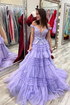 Vestido de fiesta largo rosa de tul con volantes y hombros descubiertos con lazo