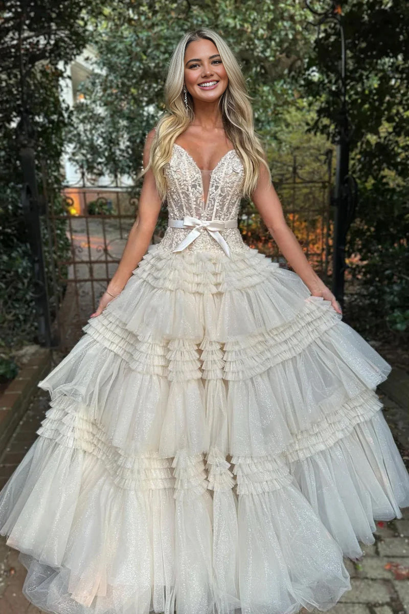 Vestido de fiesta largo rosa de tul con volantes y hombros descubiertos con lazo