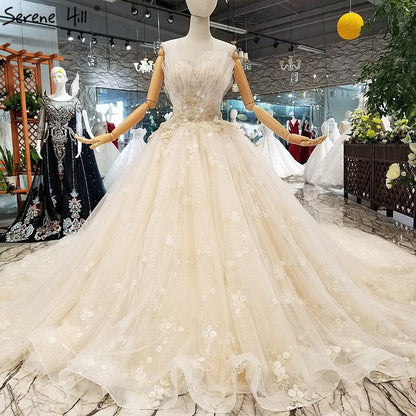 Vestidos de novia sin tirantes estilo princesa, hechos a mano, con flores y cristales.