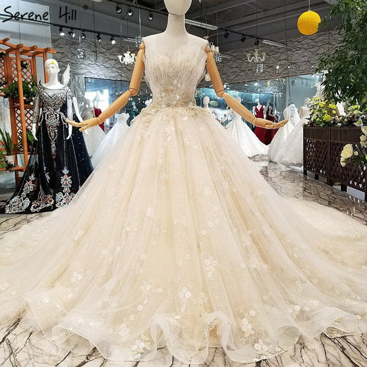Vestidos de novia sin tirantes estilo princesa, hechos a mano, con flores y cristales.