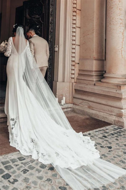 Vestidos de novia románticos de sirena con mangas largas y espalda descubierta