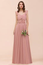 Vestido maxi rosa empolvado de dama de honor con tirantes y volantes en forma de A para niñas