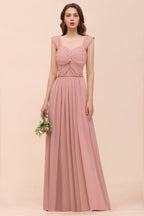 Vestido maxi rosa empolvado de dama de honor con tirantes y volantes en forma de A para niñas